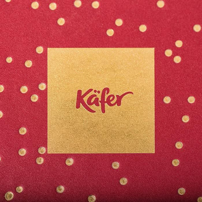 Rote Geschenkbox mit Laurent - Perrier Brut und Pralinen -